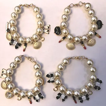 Jóia da forma do arco/shell charme elástico pulseira de pérolas&pulseiras para as mulheres/pulseras/pulseira/brazaletebracciali donna/bransoletka